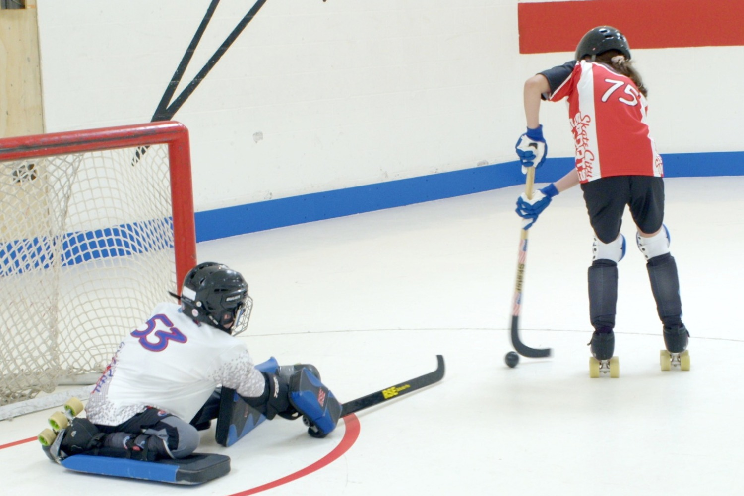 Players competing in a ball hockey league game at Skate City Sports in Colorado